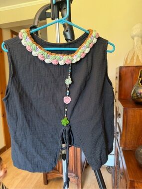 Black Sleeveless Top with Crochet Flower Neckline
